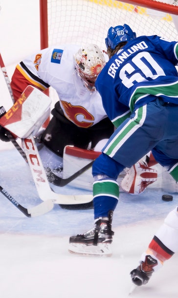 Pettersson scores 1st goal, Canucks beat Flames 5-2